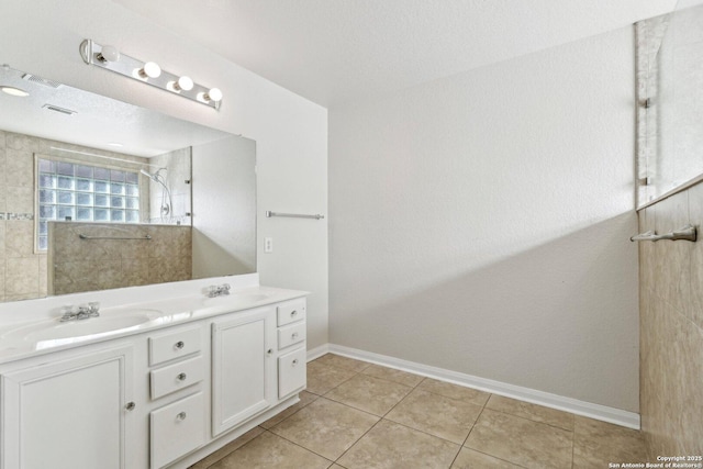 bathroom featuring tile patterned floors and vanity