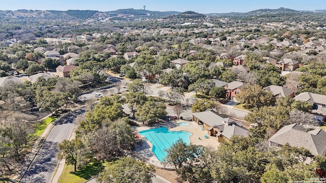 birds eye view of property with a mountain view