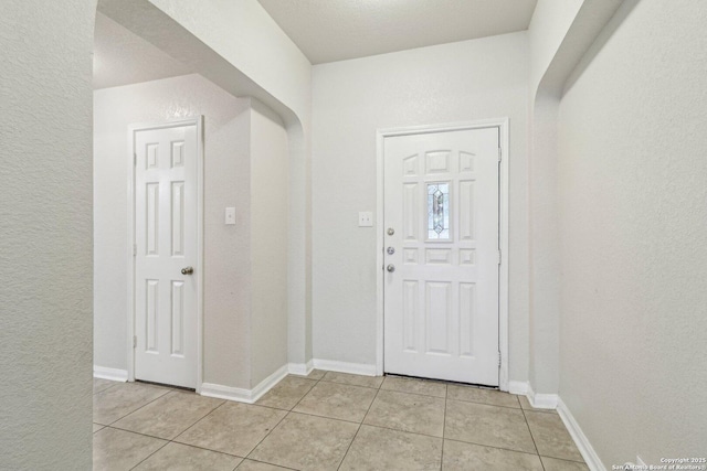 entryway featuring light tile patterned floors