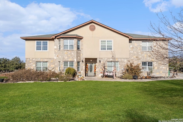 rear view of property featuring a yard