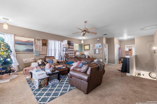 carpeted living room featuring ceiling fan