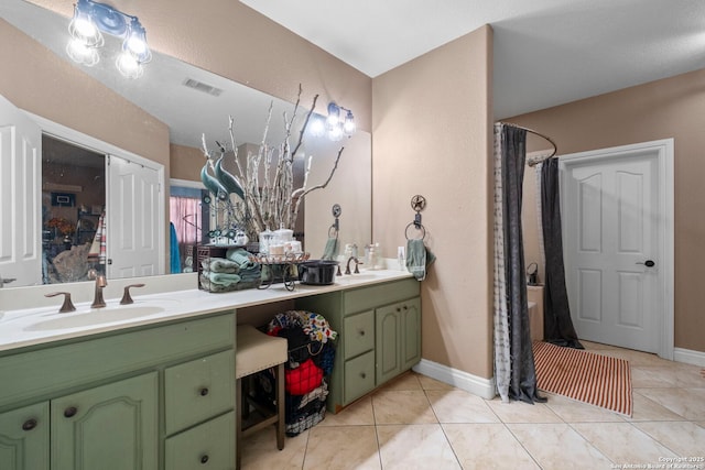 bathroom with vanity and tile patterned floors