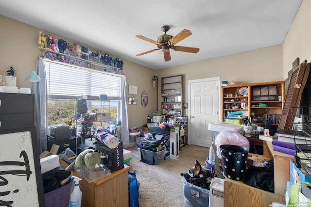 carpeted office featuring ceiling fan