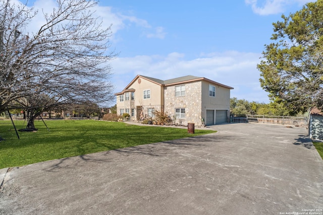 view of home's exterior featuring a garage and a yard