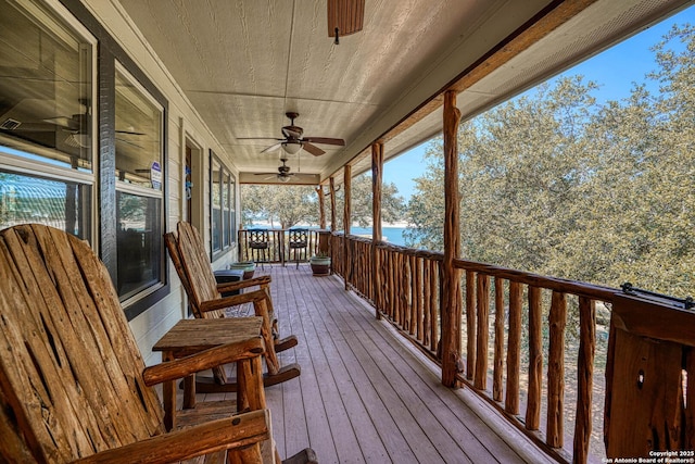 wooden terrace featuring ceiling fan