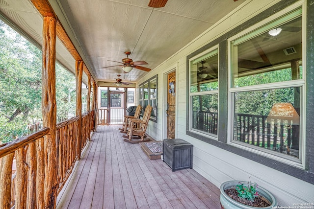 sunroom / solarium with ceiling fan