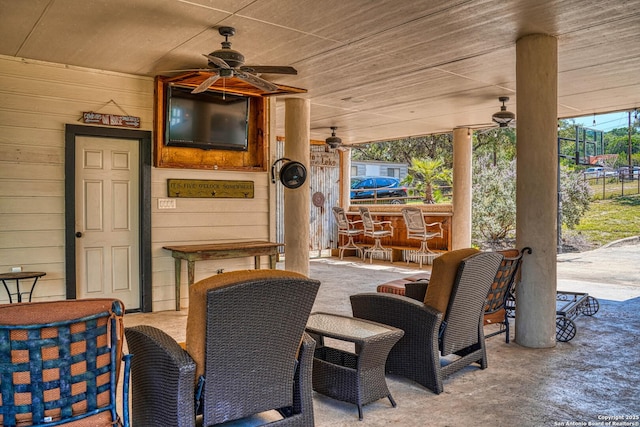 view of patio featuring ceiling fan