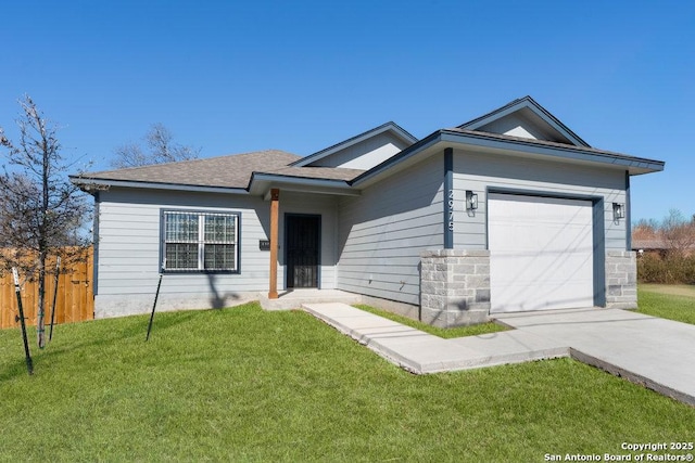 ranch-style home featuring a garage and a front yard