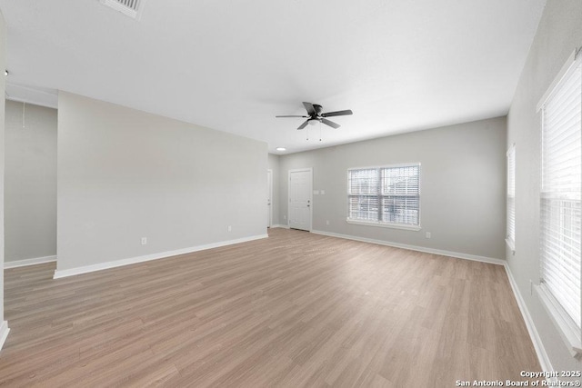 spare room featuring ceiling fan and light hardwood / wood-style floors