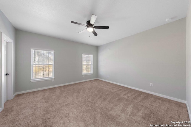 unfurnished room with light carpet and ceiling fan