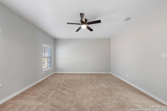 unfurnished room featuring ceiling fan and light colored carpet