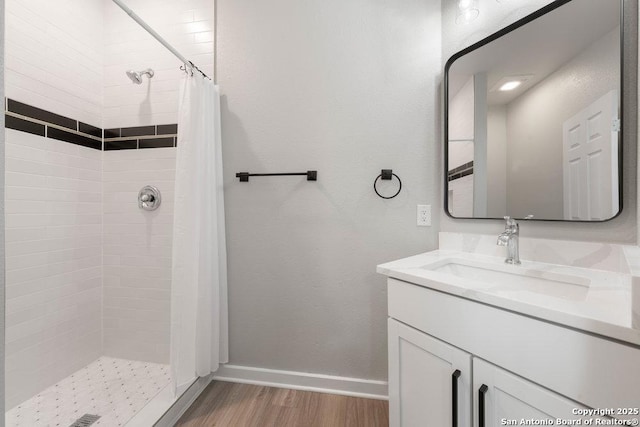 bathroom with vanity, hardwood / wood-style floors, and a shower with curtain