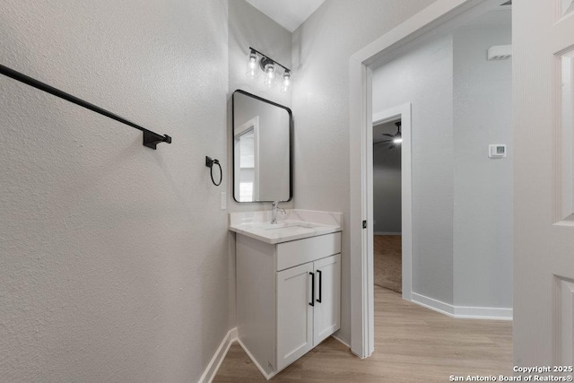 bathroom with vanity and wood-type flooring