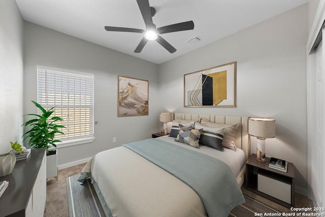 bedroom featuring ceiling fan and carpet floors