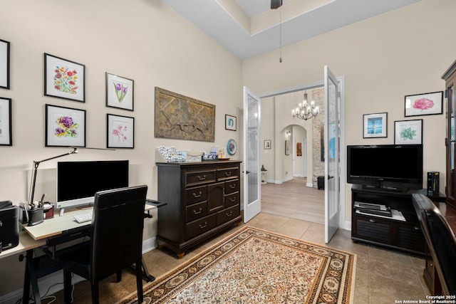 home office with tile patterned flooring and a towering ceiling