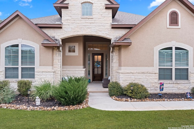 doorway to property with a yard