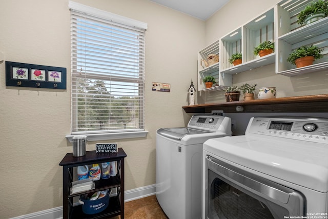 laundry room with plenty of natural light and separate washer and dryer