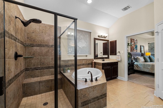 bathroom with lofted ceiling, vanity, tile patterned flooring, and separate shower and tub