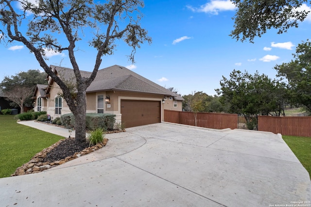 view of front facade with a garage and a front lawn