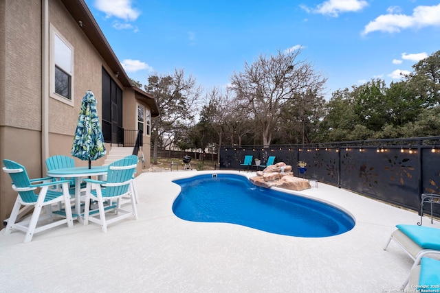 view of pool featuring a patio