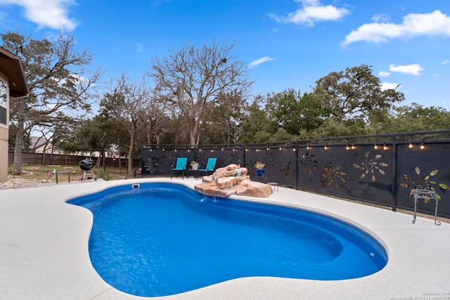 view of pool featuring a patio area