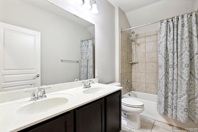 full bathroom with lofted ceiling, tile patterned flooring, vanity, shower / bath combination with curtain, and toilet