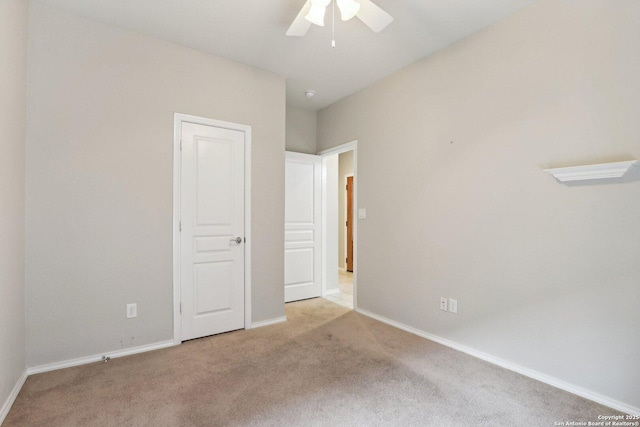 unfurnished bedroom with light colored carpet and ceiling fan