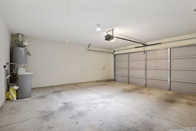 garage with a garage door opener and water heater