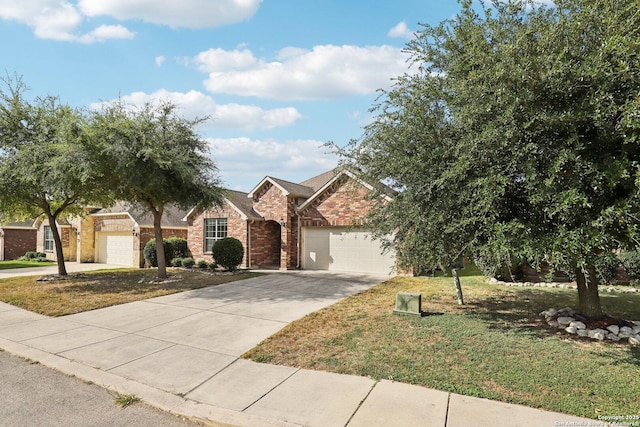 view of front of house featuring a garage and a front lawn