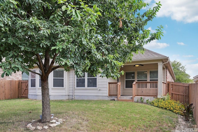 obstructed view of property featuring a front lawn