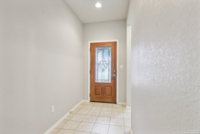 doorway to outside featuring light tile patterned floors