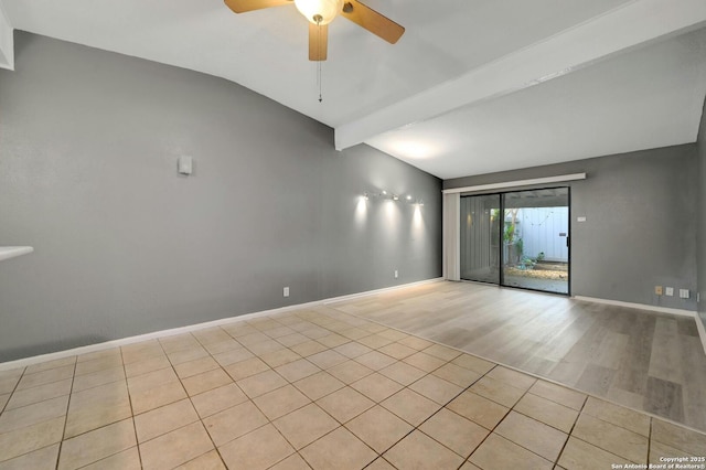 tiled spare room featuring lofted ceiling and ceiling fan