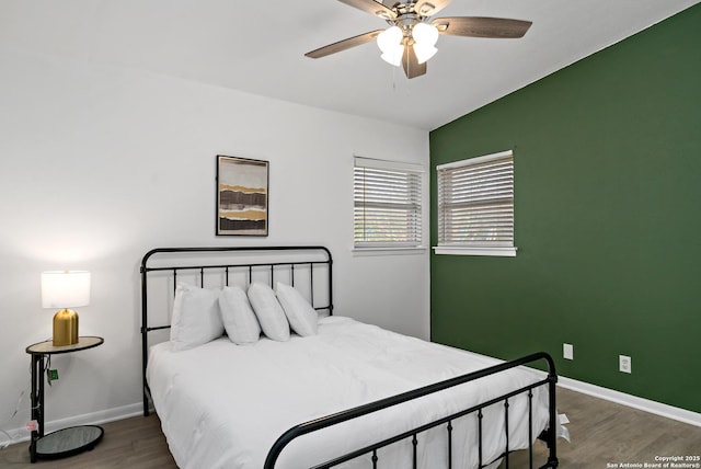 bedroom with dark wood-type flooring and ceiling fan