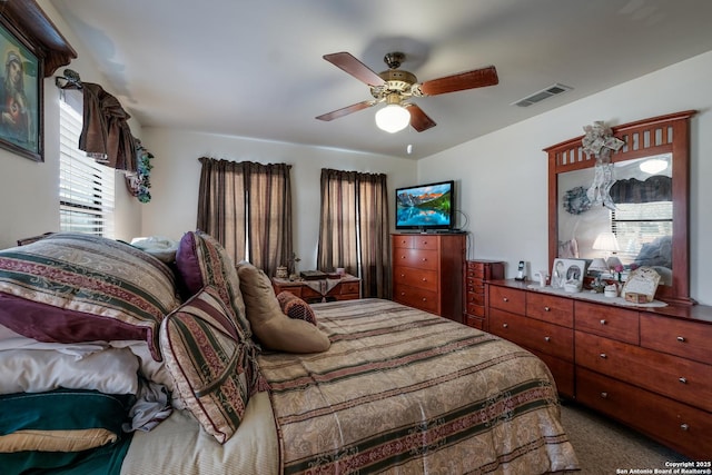 bedroom with ceiling fan and carpet flooring