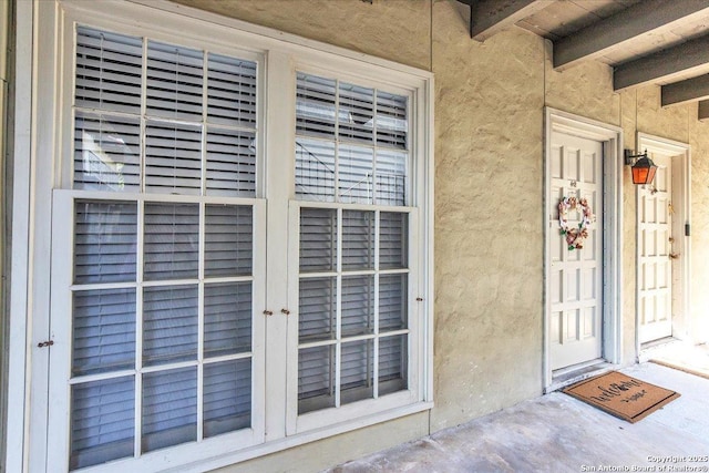 view of exterior entry featuring french doors