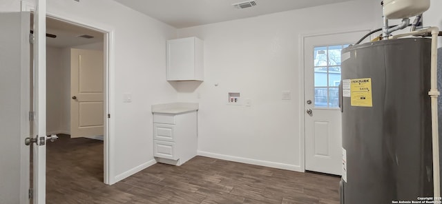 washroom featuring cabinets, washer hookup, and electric water heater