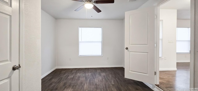 unfurnished room featuring ceiling fan and dark hardwood / wood-style floors