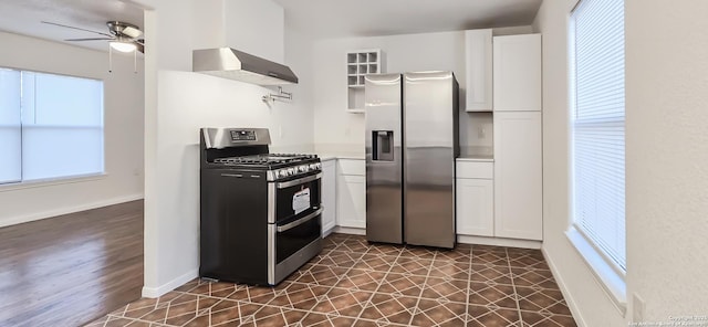 kitchen with stainless steel appliances, extractor fan, white cabinets, and ceiling fan