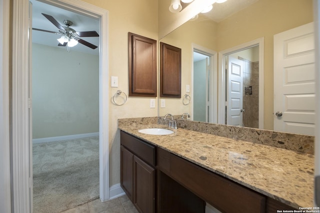 bathroom with vanity, tile patterned flooring, and ceiling fan