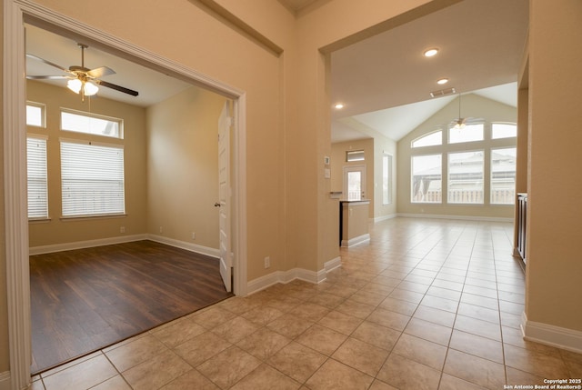 tiled entrance foyer featuring ceiling fan and lofted ceiling