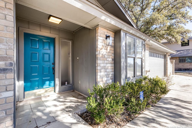 doorway to property featuring a garage