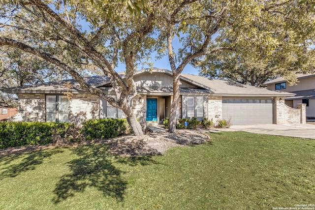 view of front of home with a garage and a front yard