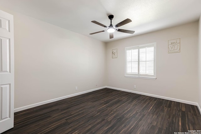 unfurnished room featuring dark hardwood / wood-style floors and ceiling fan