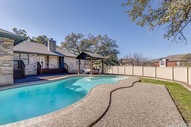 view of pool featuring a jacuzzi and a patio area