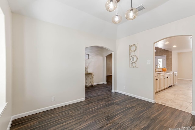 unfurnished room with dark hardwood / wood-style flooring