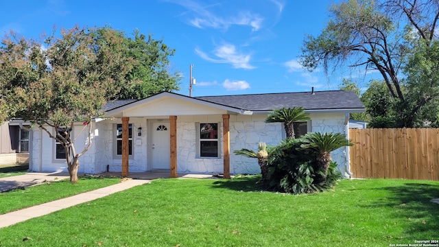 view of front of property with a front lawn