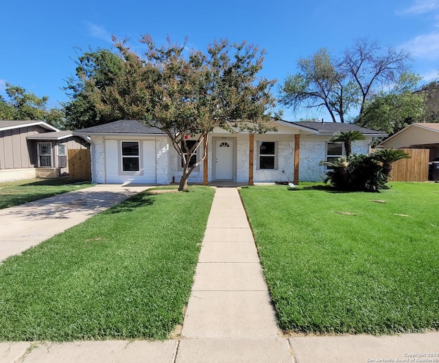 ranch-style home with a front yard