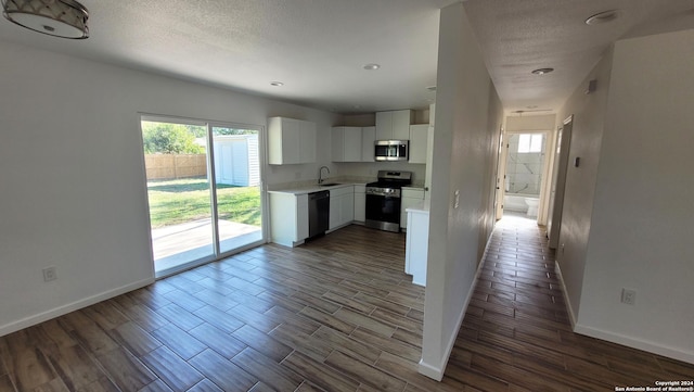 kitchen with white cabinetry, appliances with stainless steel finishes, and sink