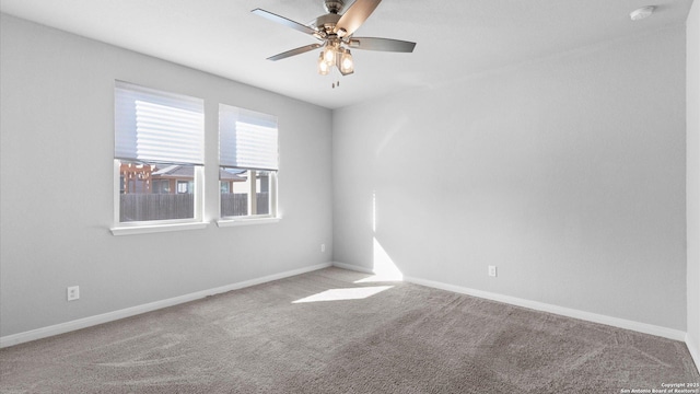 carpeted empty room with ceiling fan