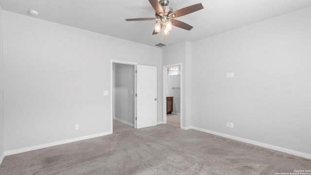 spare room with light carpet and ceiling fan